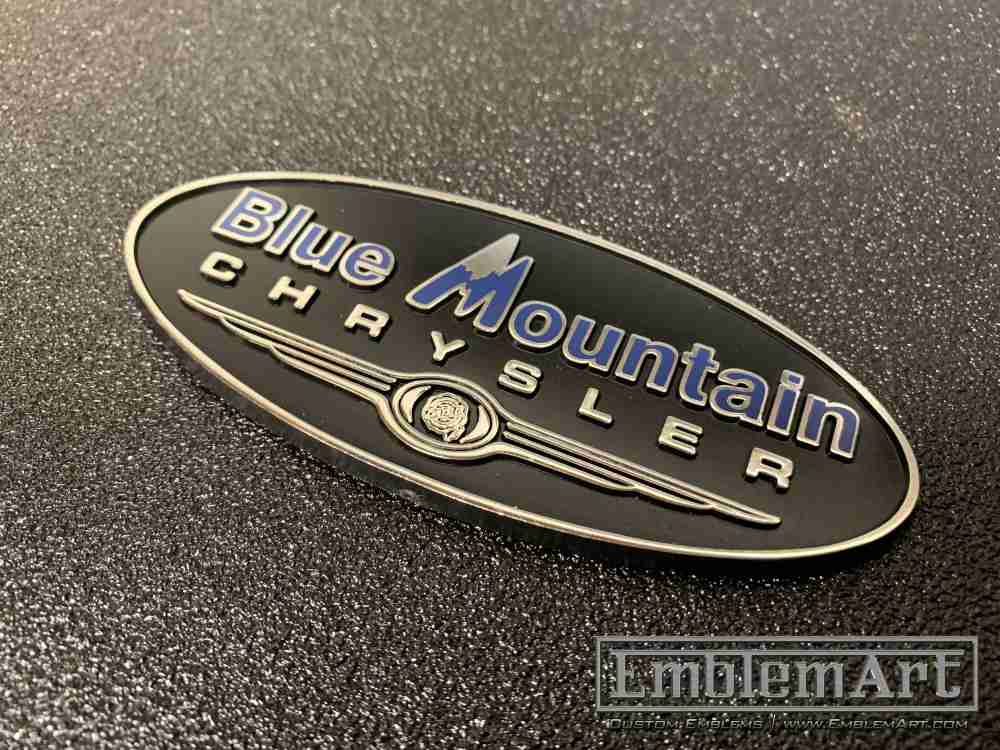 Custom Molded Plastic Emblems - Custom Blue Mountain Molded Black Chrome Foil Blue Pad Emblem