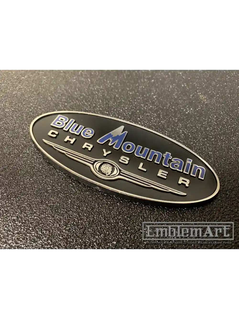 Custom Molded Plastic Emblems - Blue Mountain Molded Black Chrome Foil Blue Pad Emblem